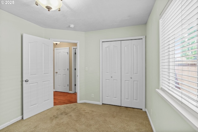3473 Parker Ln, Springfield, OR 97477 - unfurnished bedroom featuring carpet, baseboards, and a closet
