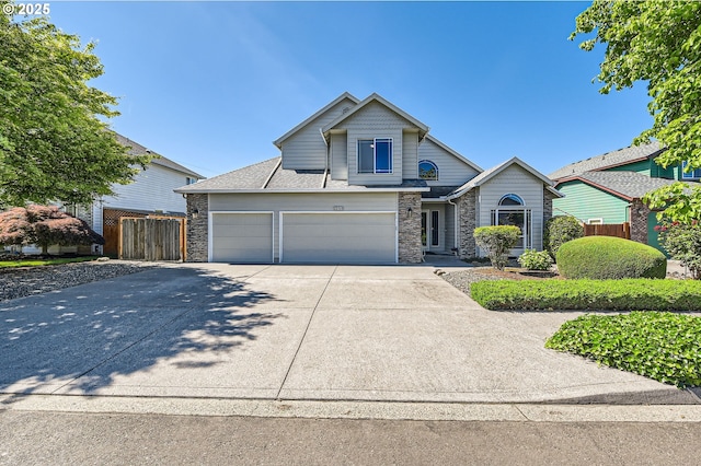 22160 NE Lachenview Ln, Fairview, OR 97024 - view of front of house featuring stone siding, driveway, and a garage
