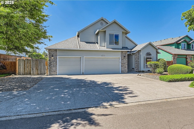 22160 NE Lachenview Ln, Fairview, OR 97024 - view of front of property featuring stone siding, concrete driveway, and a garage