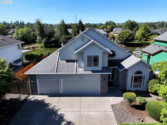 22160 NE Lachenview Ln, Fairview, OR 97024 - view of front facade with driveway, stone siding, roof with shingles, and a garage