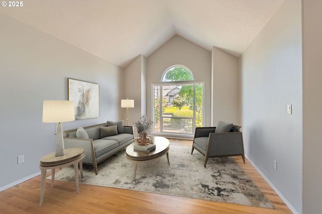 22160 NE Lachenview Ln, Fairview, OR 97024 - living area featuring lofted ceiling, wood finished floors, and baseboards