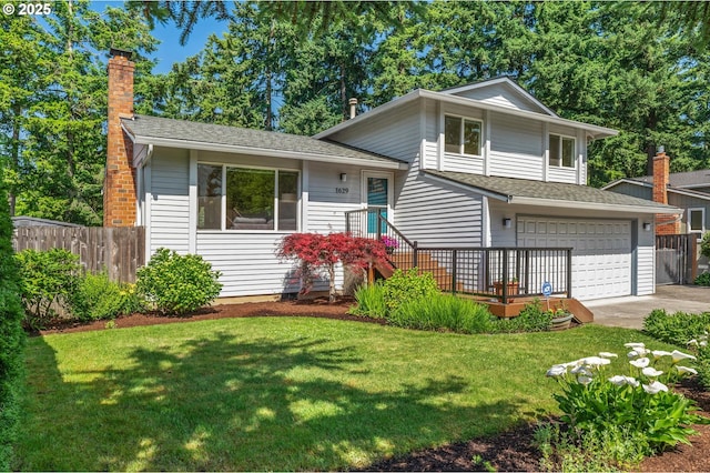 1629 NW Orchard Ave, Gresham, OR 97030 - split level home with a chimney, concrete driveway, an attached garage, and a shingled roof