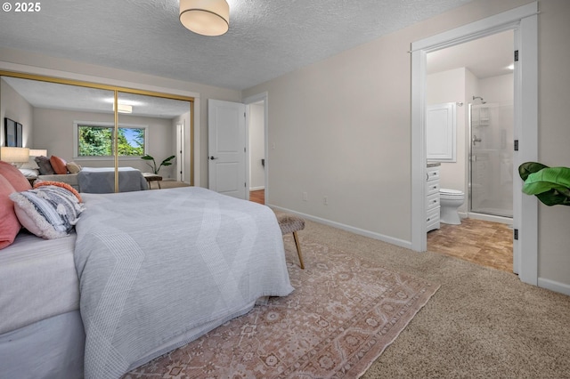 1629 NW Orchard Ave, Gresham, OR 97030 - carpeted bedroom with a closet, baseboards, ensuite bathroom, and a textured ceiling