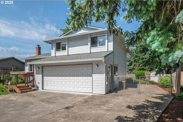 1629 NW Orchard Ave, Gresham, OR 97030 - view of front facade featuring a gate, an attached garage, concrete driveway, a shingled roof, and a wooden deck
