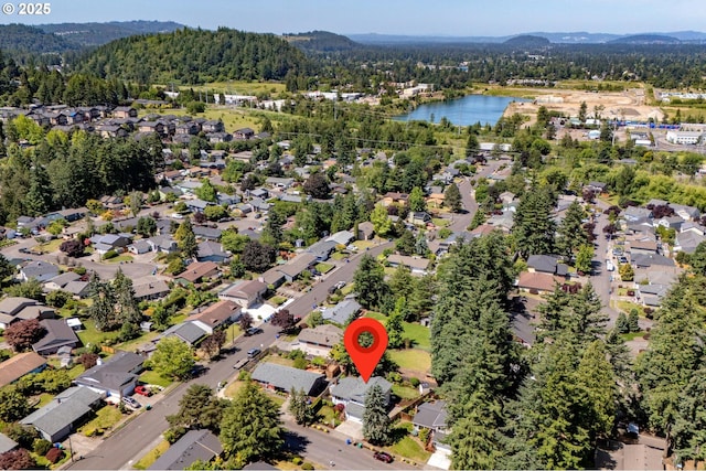 1629 NW Orchard Ave, Gresham, OR 97030 - aerial overview of property's location featuring a heavily wooded area, nearby suburban area, and a water and mountain view