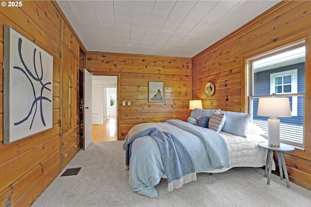 26 NW 22nd Pl, Portland, OR 97210 - bedroom with wooden walls and carpet floors