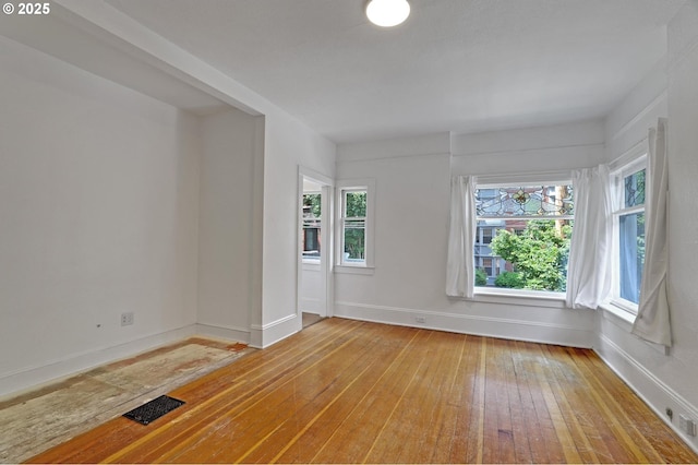 26 NW 22nd Pl, Portland, OR 97210 - empty room with light wood finished floors and baseboards