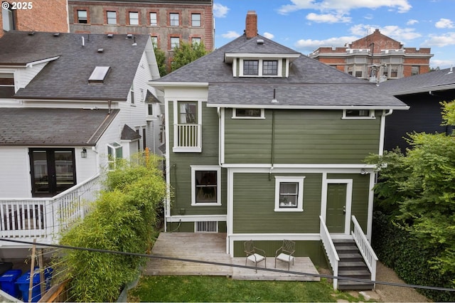 26 NW 22nd Pl, Portland, OR 97210 - rear view of property featuring a shingled roof and a chimney