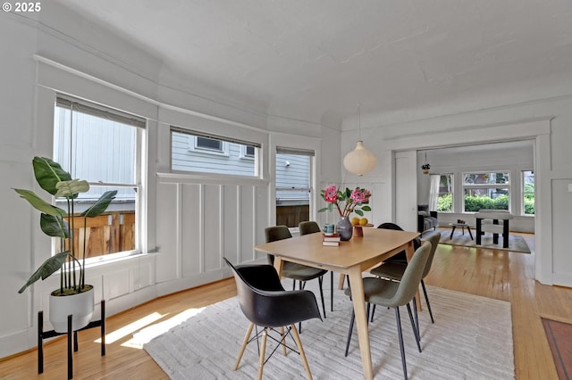 26 NW 22nd Pl, Portland, OR 97210 - dining space with light wood-type flooring and a decorative wall