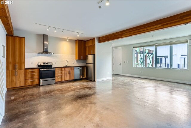 325 NE Graham St Unit 10, Portland, OR 97212 - kitchen featuring wall chimney range hood, appliances with stainless steel finishes, a sink, and rail lighting