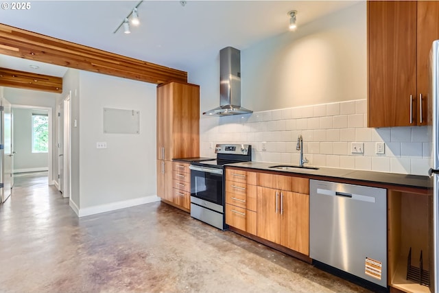 325 NE Graham St Unit 10, Portland, OR 97212 - kitchen with appliances with stainless steel finishes, wall chimney range hood, a sink, concrete floors, and dark countertops