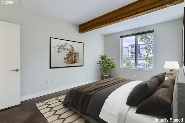 325 NE Graham St Unit 10, Portland, OR 97212 - bedroom with beam ceiling, concrete flooring, and baseboards