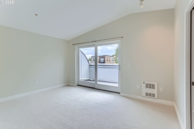 325 NE Graham St Unit 10, Portland, OR 97212 - unfurnished room with lofted ceiling, light colored carpet, baseboards, and heating unit