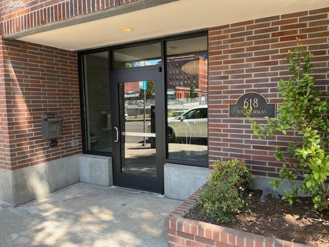 618 NW 12th Ave Unit 311, Portland, OR 97209 - property entrance featuring brick siding