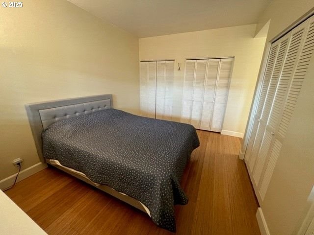 618 NW 12th Ave Unit 311, Portland, OR 97209 - bedroom featuring wood finished floors and baseboards