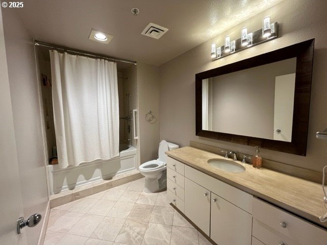 618 NW 12th Ave Unit 311, Portland, OR 97209 - bathroom with vanity, shower / bath combo, toilet, and recessed lighting