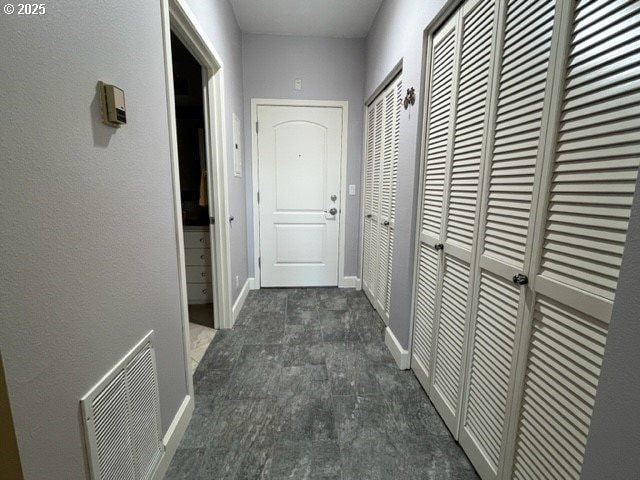 618 NW 12th Ave Unit 311, Portland, OR 97209 - hall featuring baseboards and dark colored carpet
