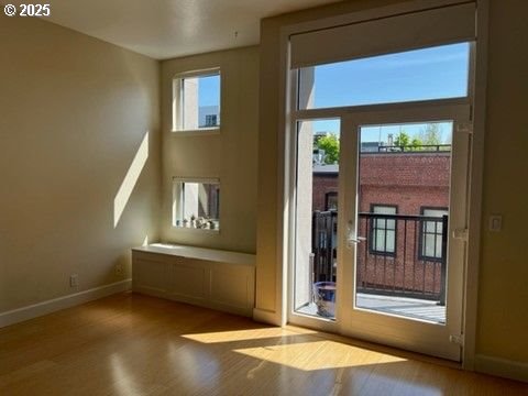 618 NW 12th Ave Unit 311, Portland, OR 97209 - entryway with baseboards and wood finished floors