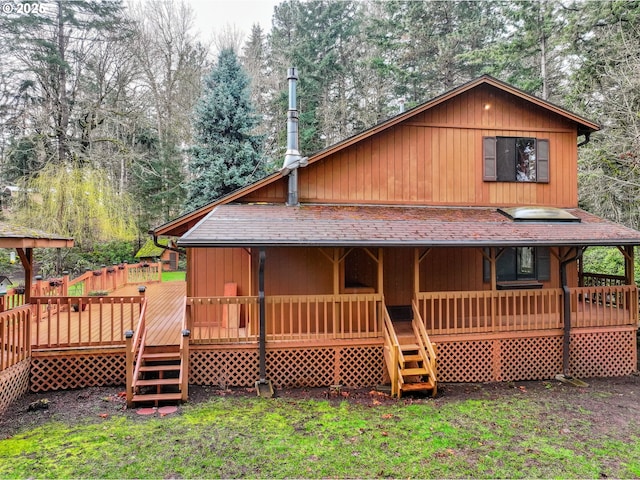view of front of home with a shingled roof