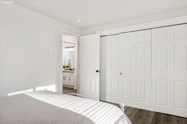 bedroom featuring a closet and dark wood-type flooring