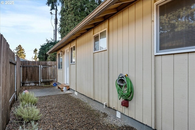 view of side of home with a patio