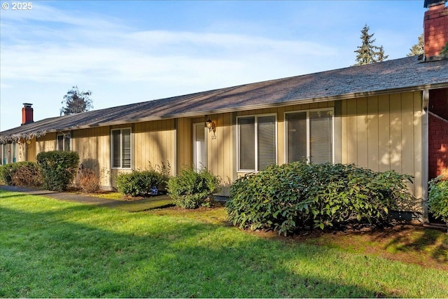 rear view of house with a lawn