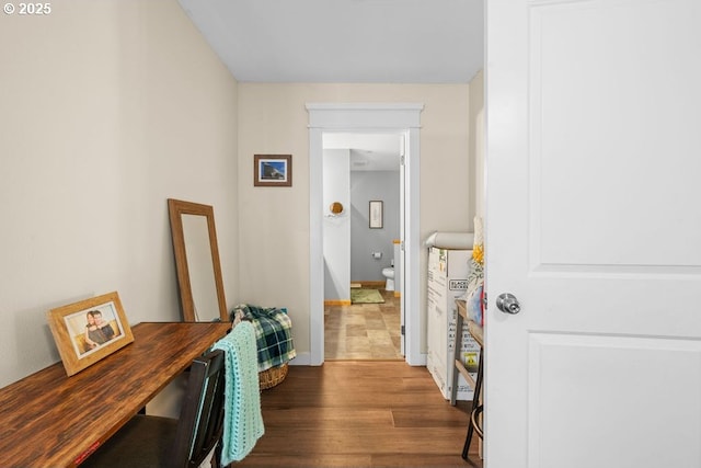 corridor with dark wood-type flooring