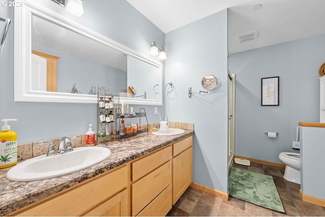 bathroom with toilet and vanity