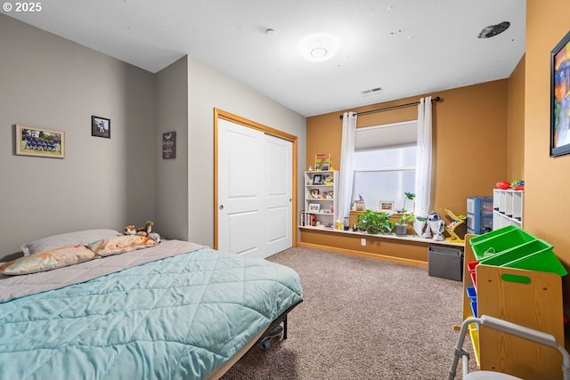 carpeted bedroom featuring a closet