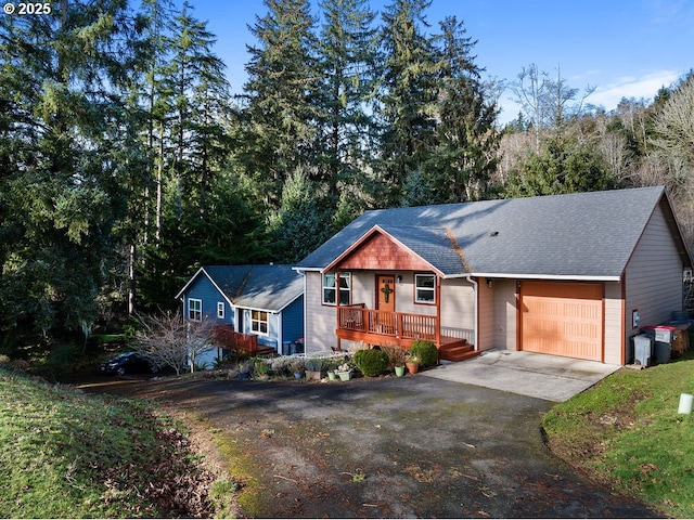 ranch-style house featuring a porch and a garage