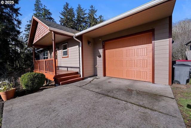 single story home with a garage and covered porch