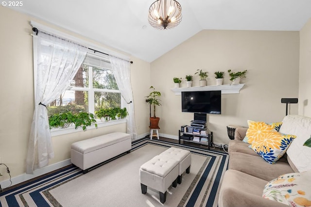 living room featuring vaulted ceiling and a chandelier