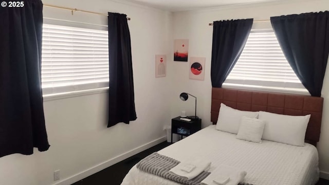 bedroom with multiple windows and baseboards