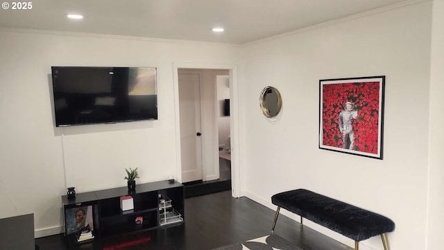 living area with recessed lighting and ornamental molding