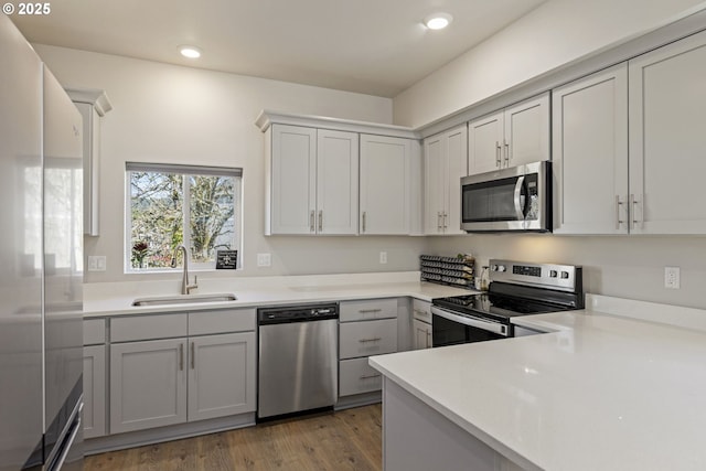 1466 N Steiwer Ln, Newberg, OR 97132 - kitchen featuring light countertops, light wood-type flooring, a sink, and stainless steel appliances