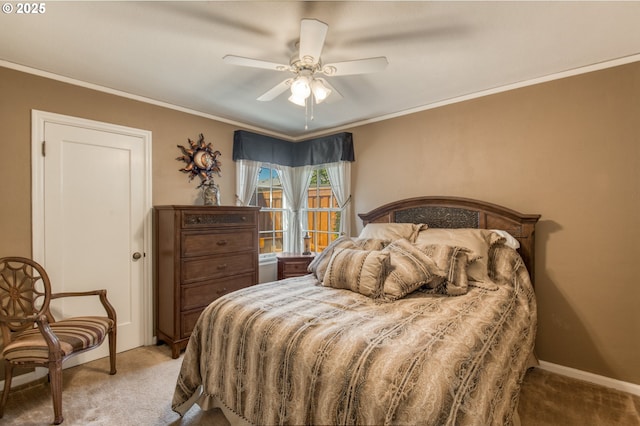 carpeted bedroom with ceiling fan and crown molding
