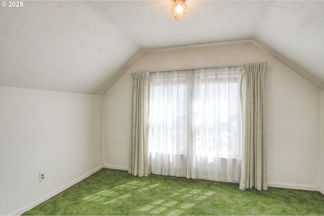 bonus room featuring vaulted ceiling, carpet floors, and baseboards