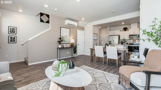 3447 SW Thomas Ave, Gresham, OR 97080 - living area featuring a wall unit AC, wood finished floors, and recessed lighting