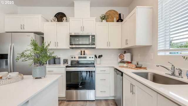3447 SW Thomas Ave, Gresham, OR 97080 - kitchen with stainless steel appliances, white cabinets, and light countertops