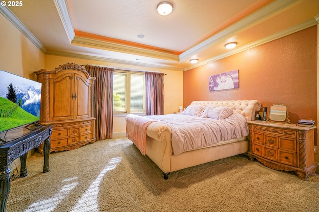 bedroom featuring a tray ceiling and crown molding