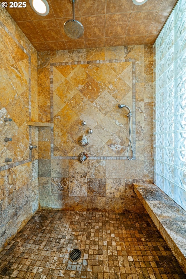 interior details with a tile shower