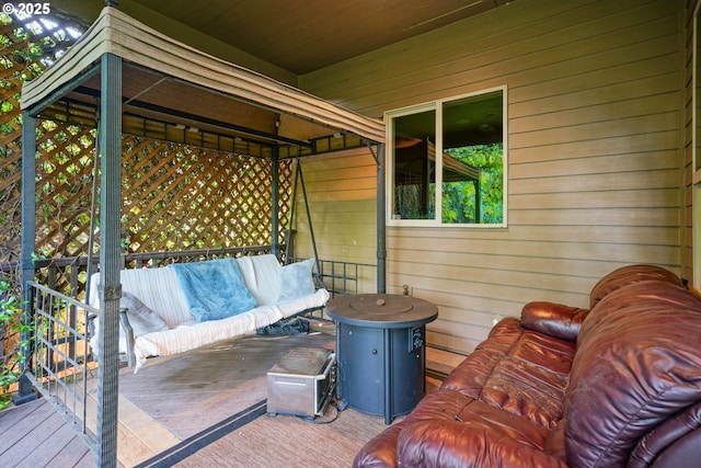 wooden terrace featuring outdoor lounge area