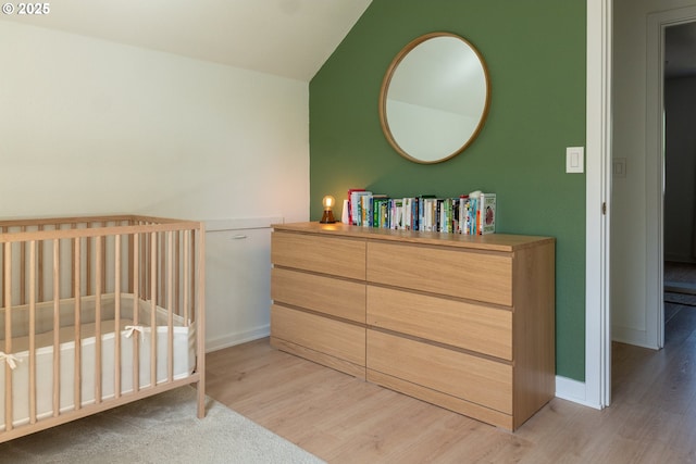 bedroom featuring baseboards and light wood-style floors