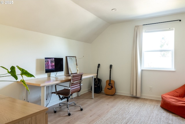 office featuring baseboards, wood finished floors, and vaulted ceiling