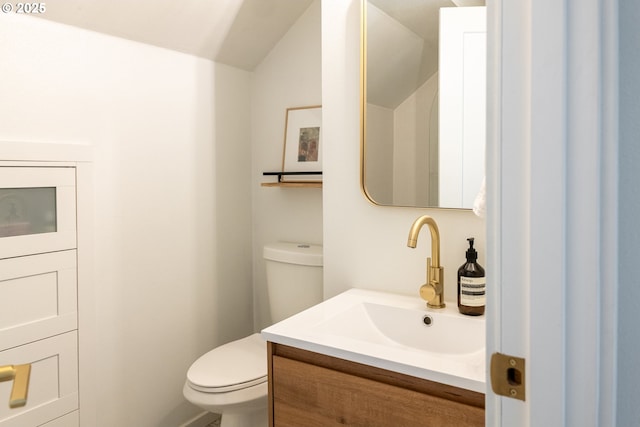 half bath with vanity and toilet