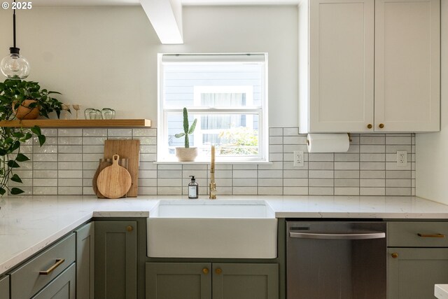 kitchen featuring open shelves, light stone counters, a sink, dishwasher, and decorative backsplash