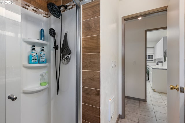 12791 Sutherland Rd, Swisshome, OR 97480 - bathroom with tile patterned floors, a shower stall, vanity, and baseboards