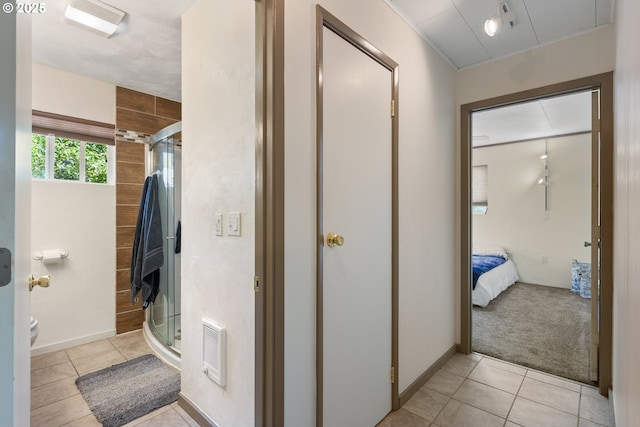 12791 Sutherland Rd, Swisshome, OR 97480 - ensuite bathroom featuring tile patterned floors, toilet, a stall shower, and heating unit