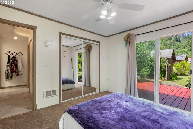 12791 Sutherland Rd, Swisshome, OR 97480 - bedroom featuring multiple windows, carpet floors, ornamental molding, ceiling fan, and access to exterior