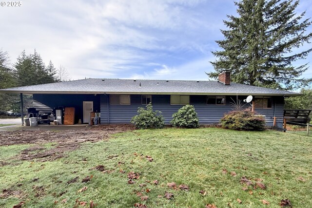 view of front of house with a chimney and a front yard